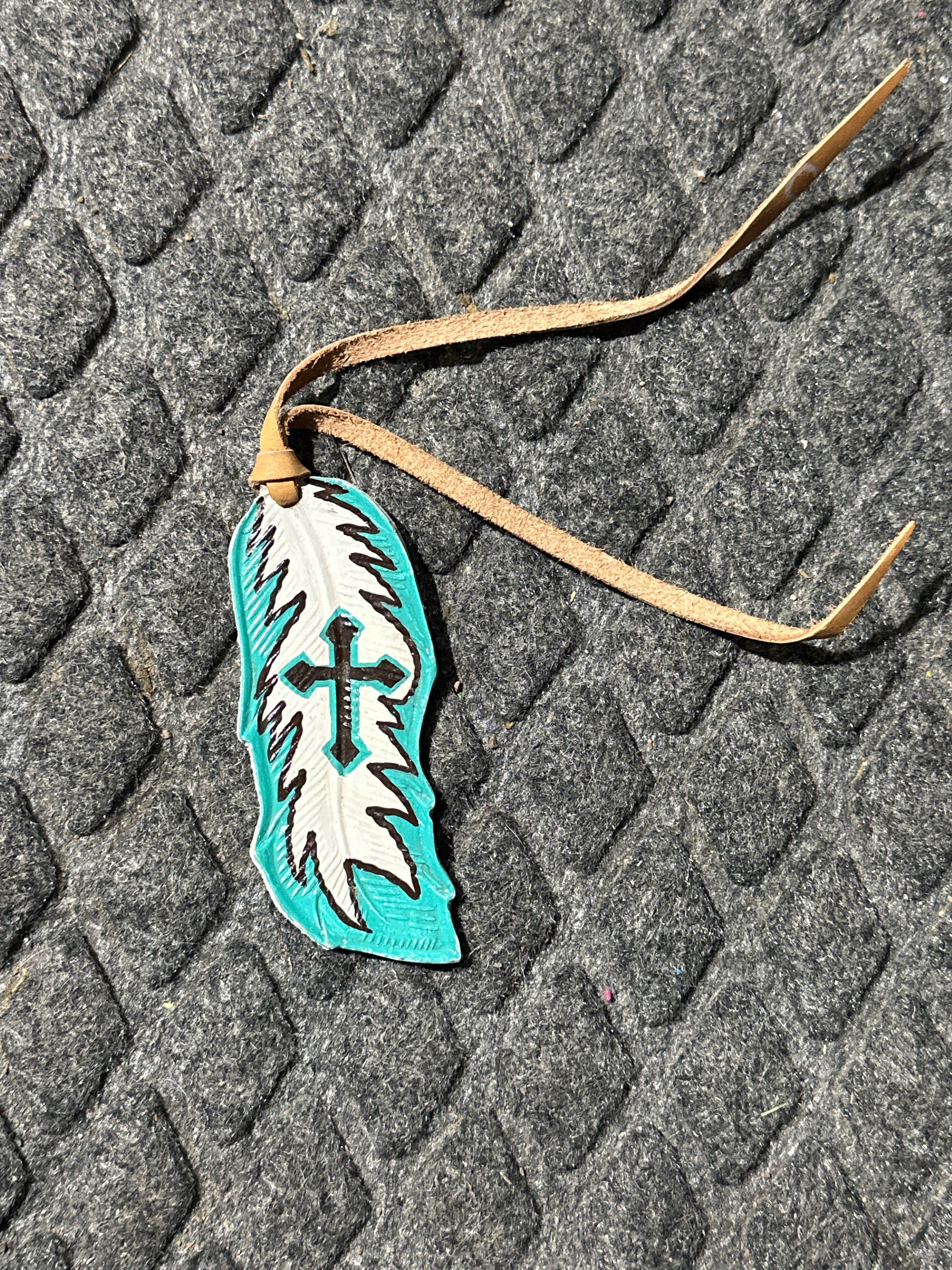 Painted on cross tie on saddle feather