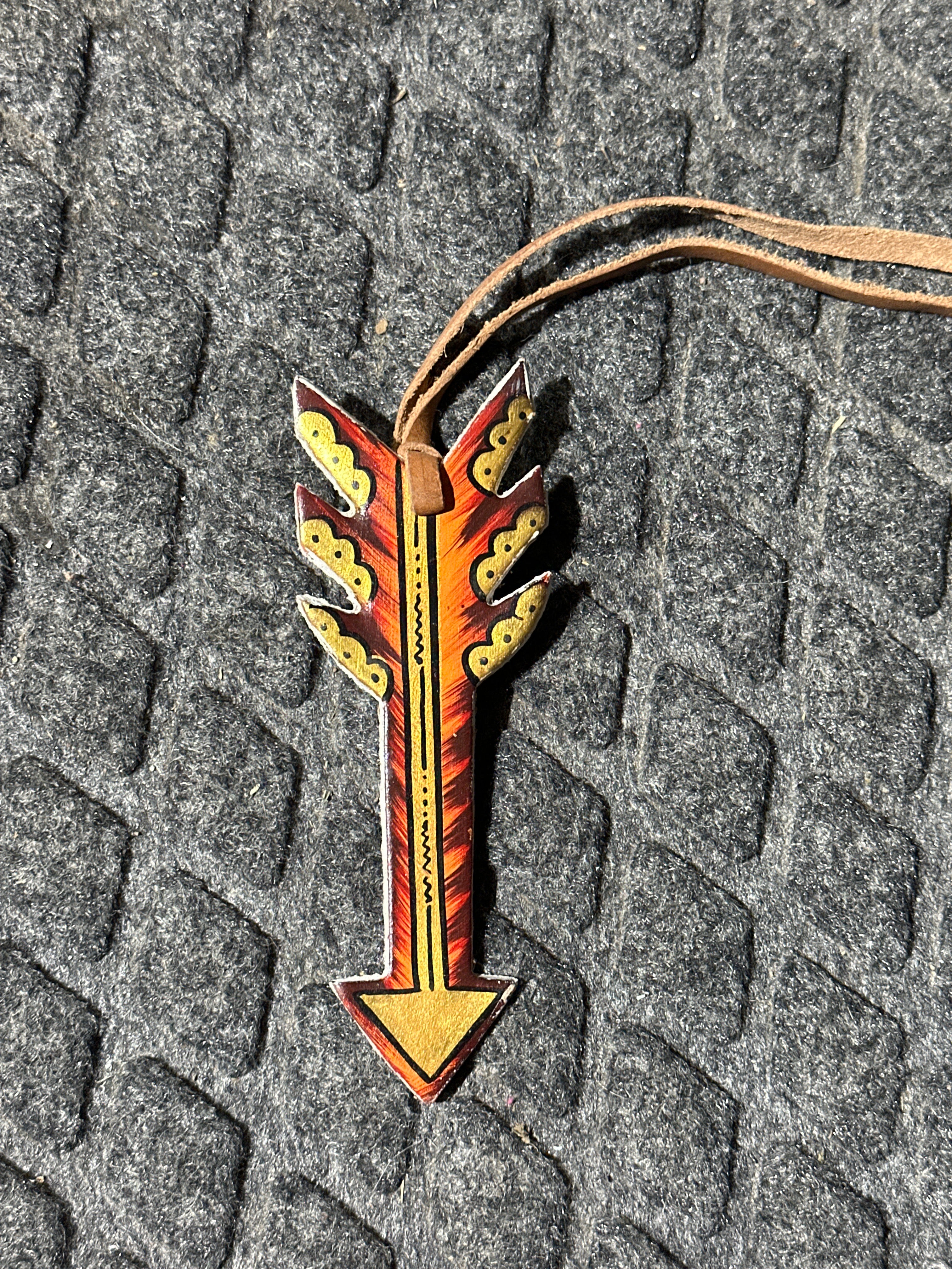Fire arrow tie on saddle charm