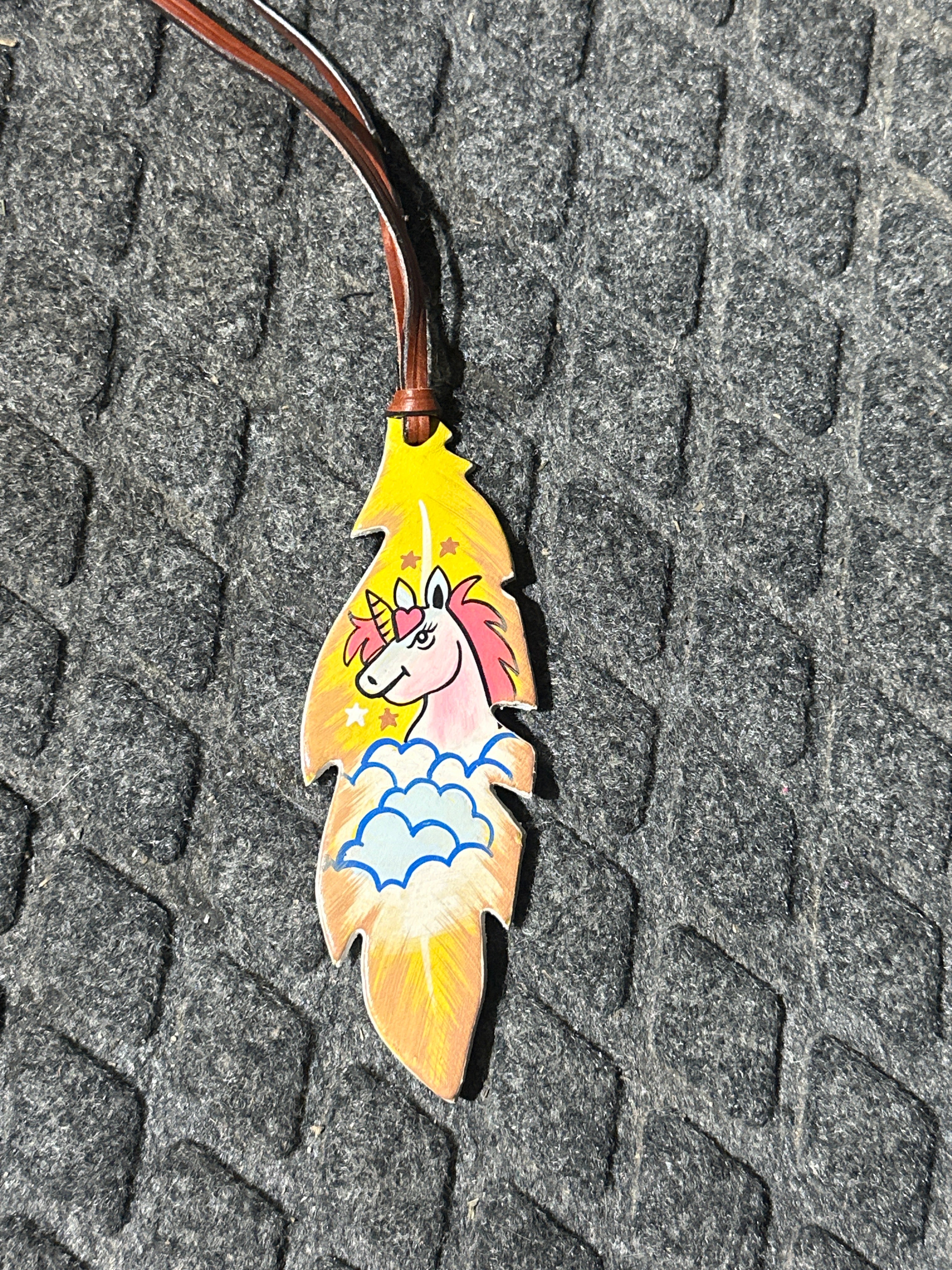 Dreamy unicorn tie on saddle feather