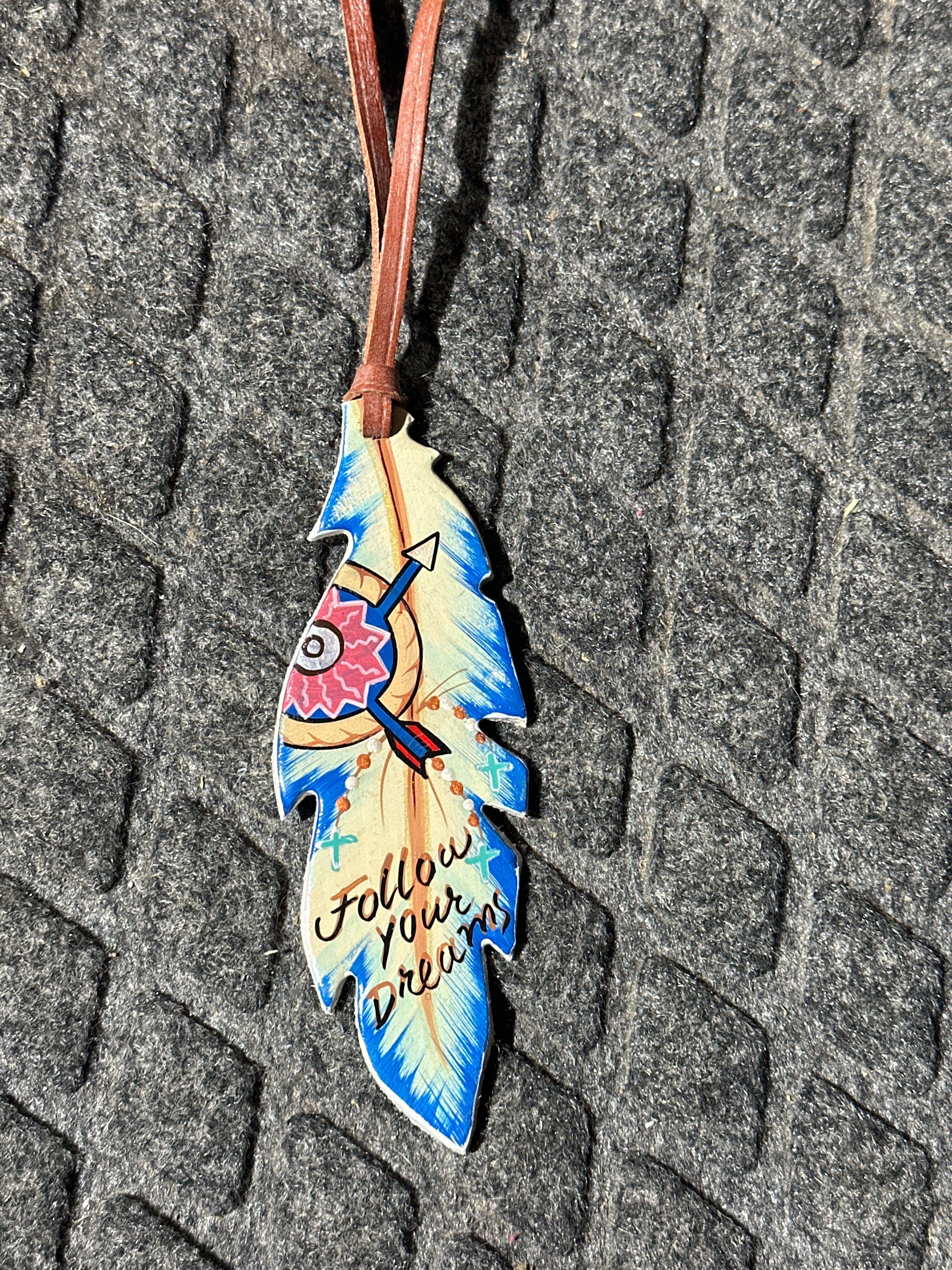Follow your dreams painted feather tie on saddle charm