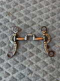 Hinged correction bit with copper barrels and antique cheeks