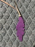 Purple sparkley tie on saddle feather