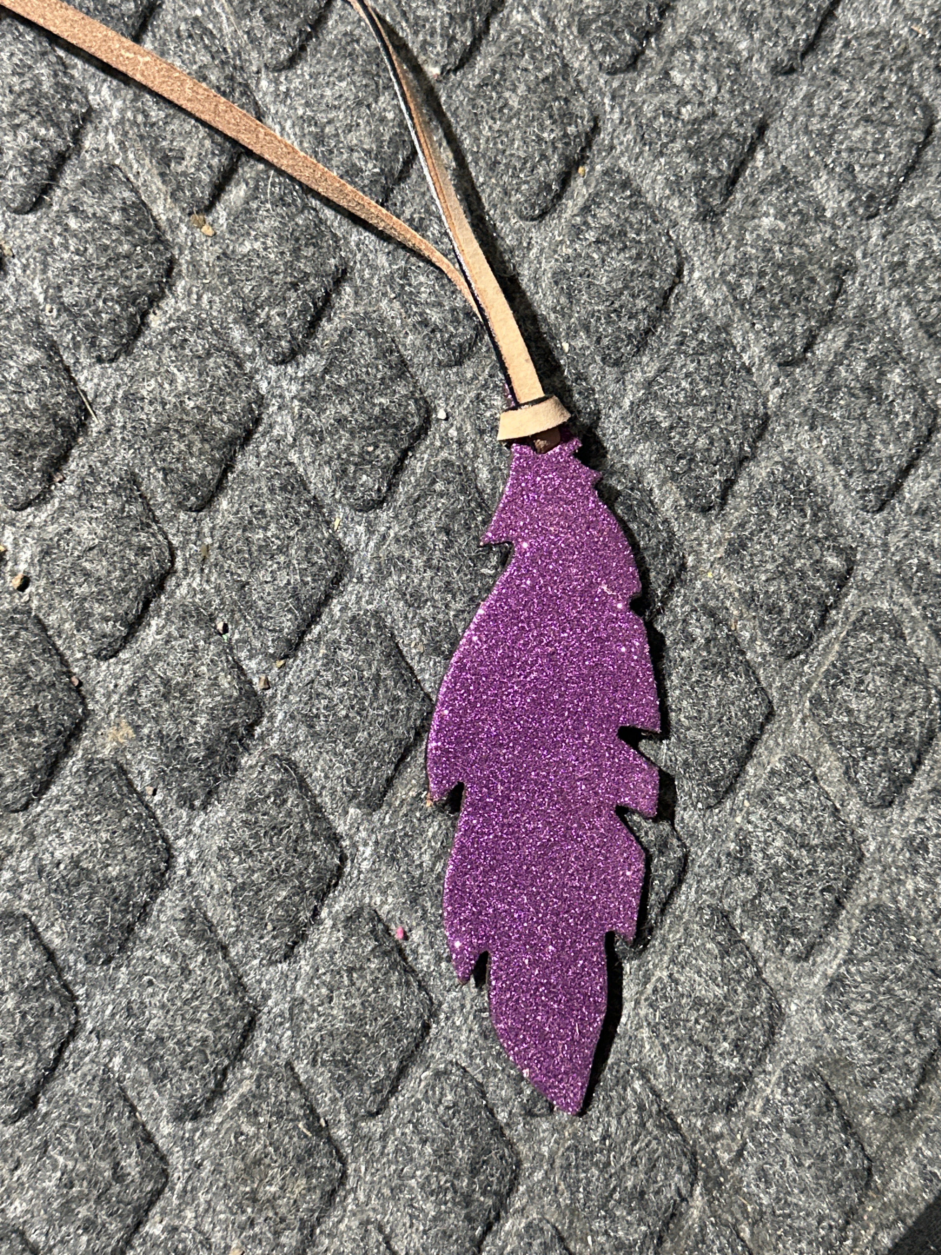 Purple sparkley tie on saddle feather