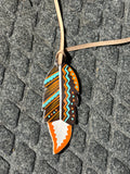 Organic tone painted tie on saddle feather