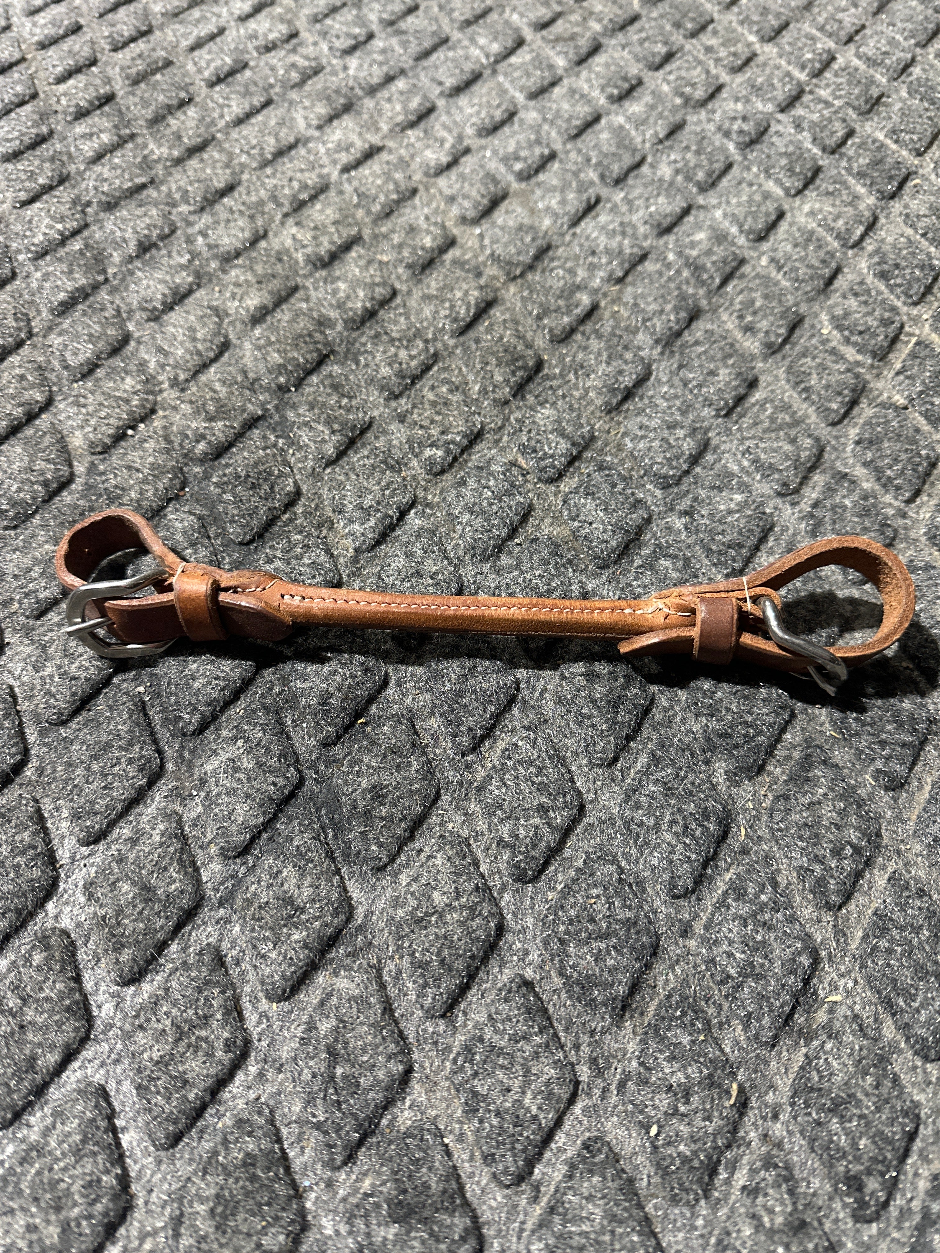 Rolled leather chin strap