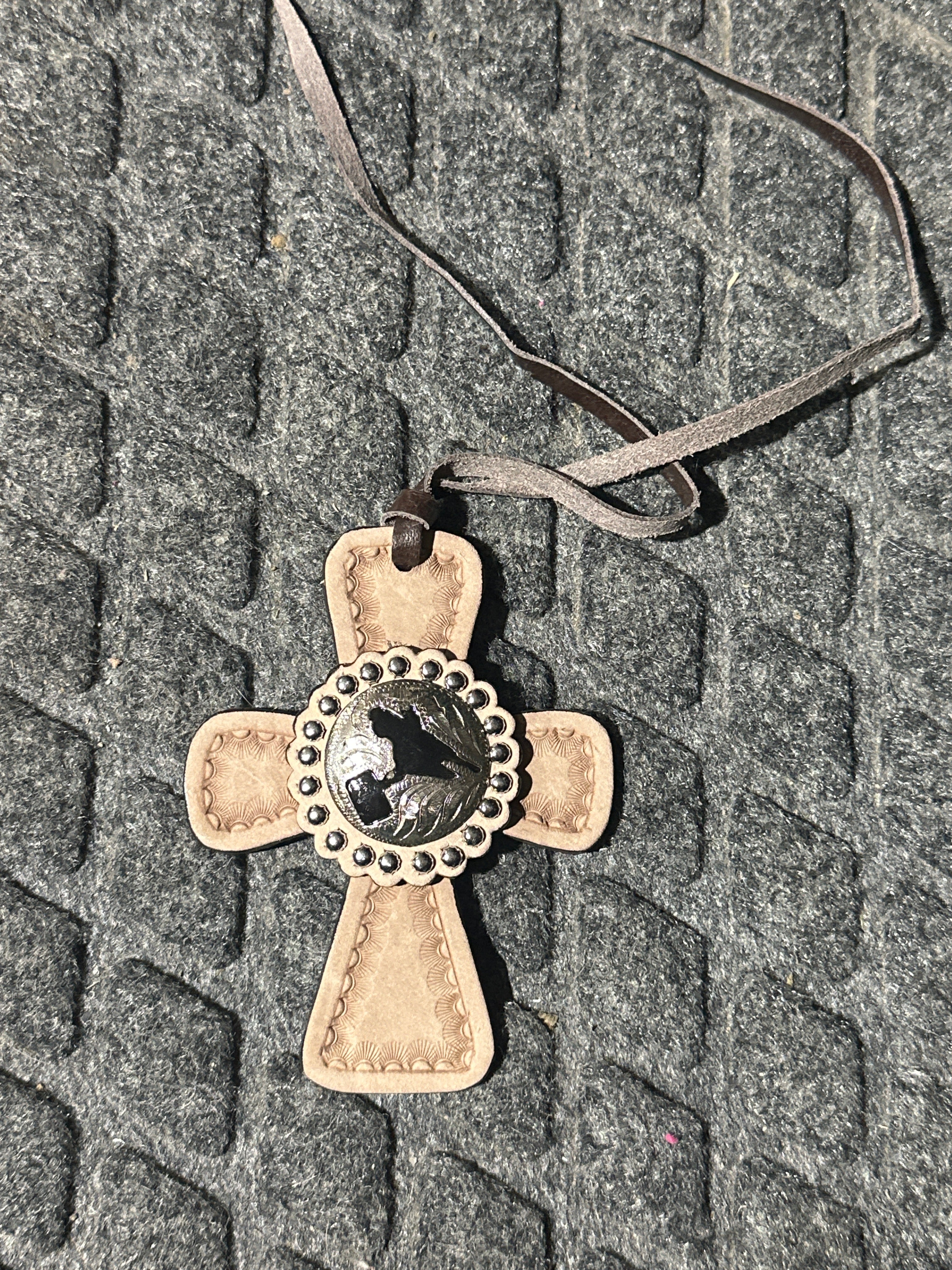 Light tone cross with barrel racer center tie on saddle charm