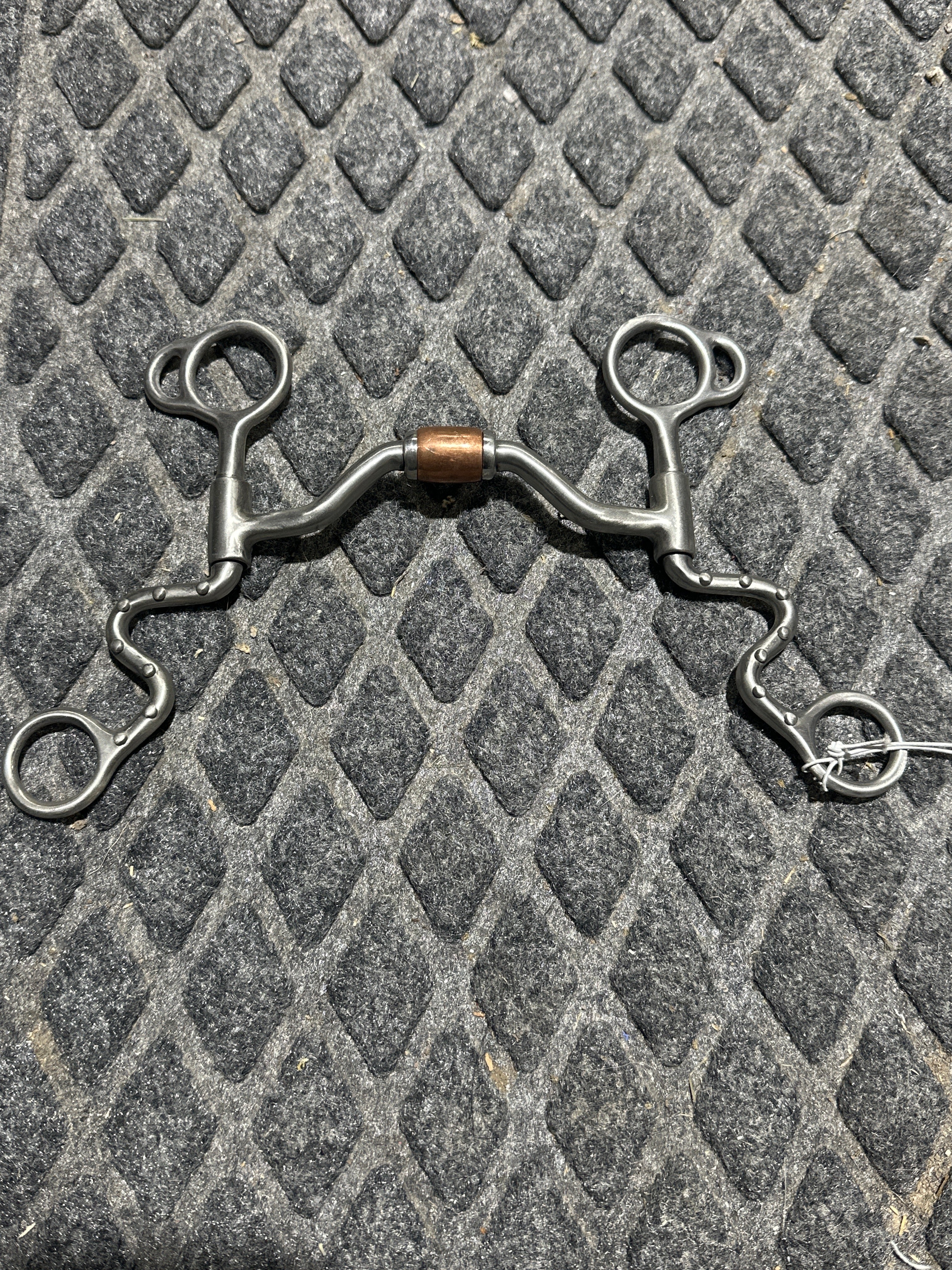 Low port bit with copper roller