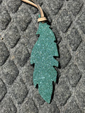 Sparkley teal tie on saddle feather