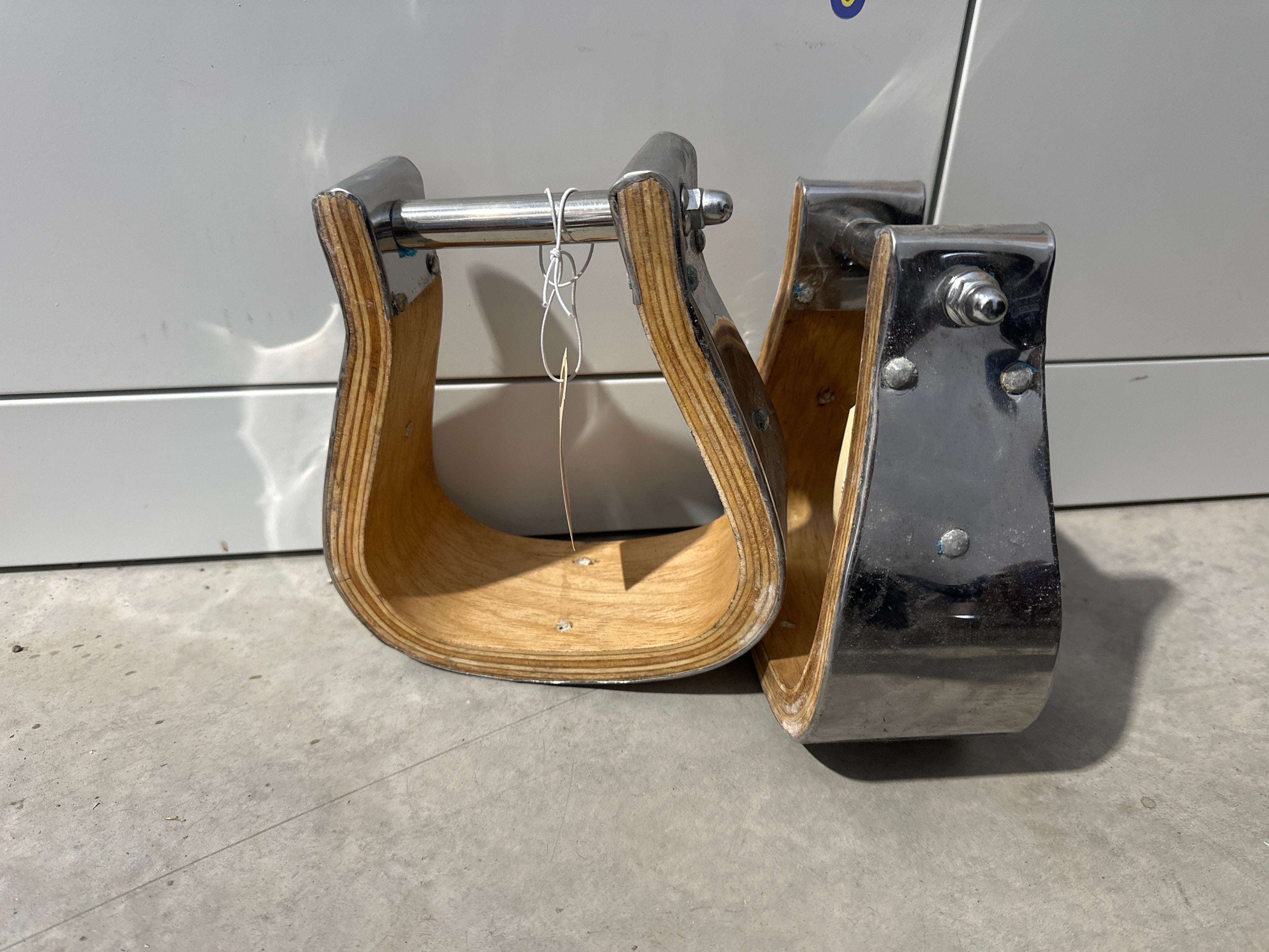 4” tread polished stainless steel covered wood stirrups