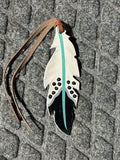 Black/ white with turquoise stripe painted tie on saddle feather
