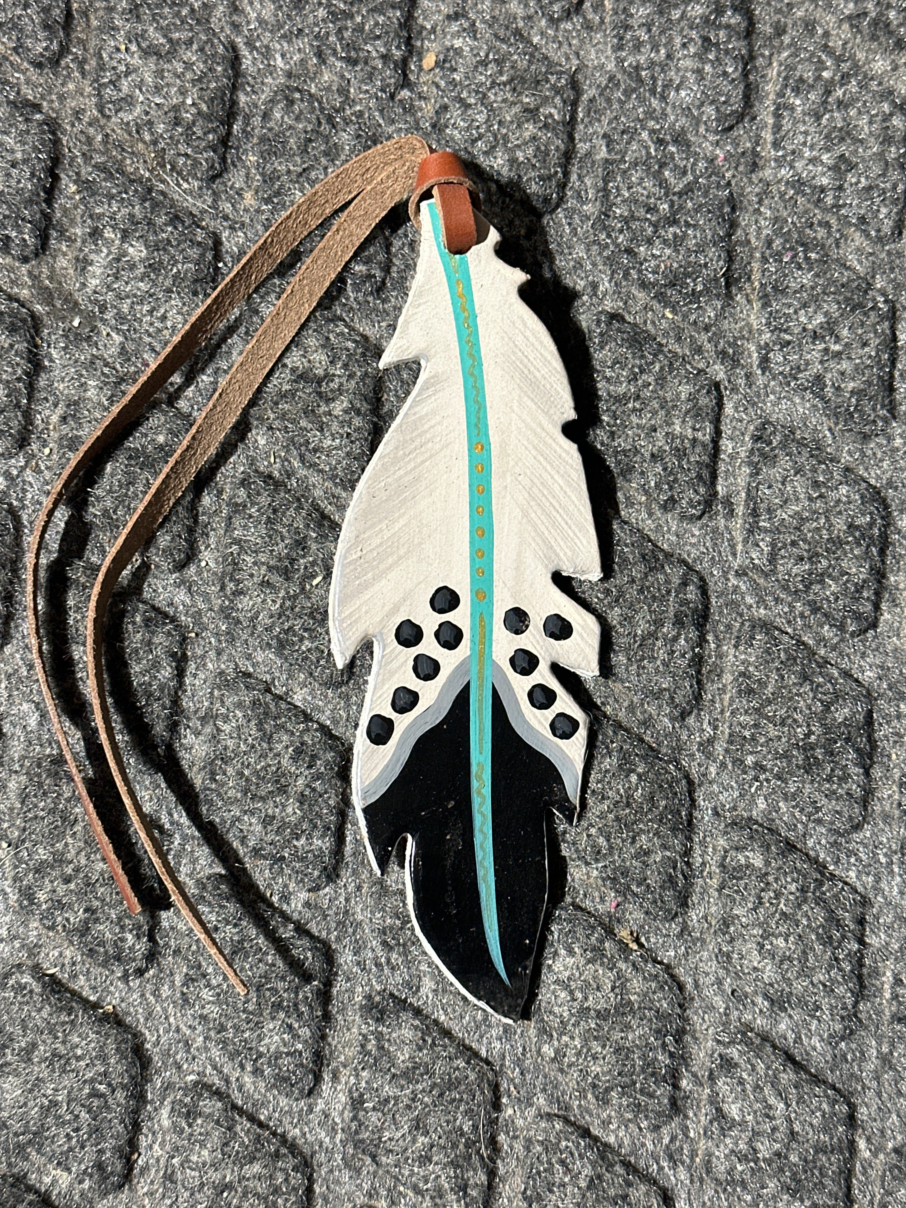 Black/ white with turquoise stripe painted tie on saddle feather