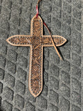 Tooled cross tie on saddle charm