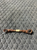 Rolled medium leather with rawhide chin strap