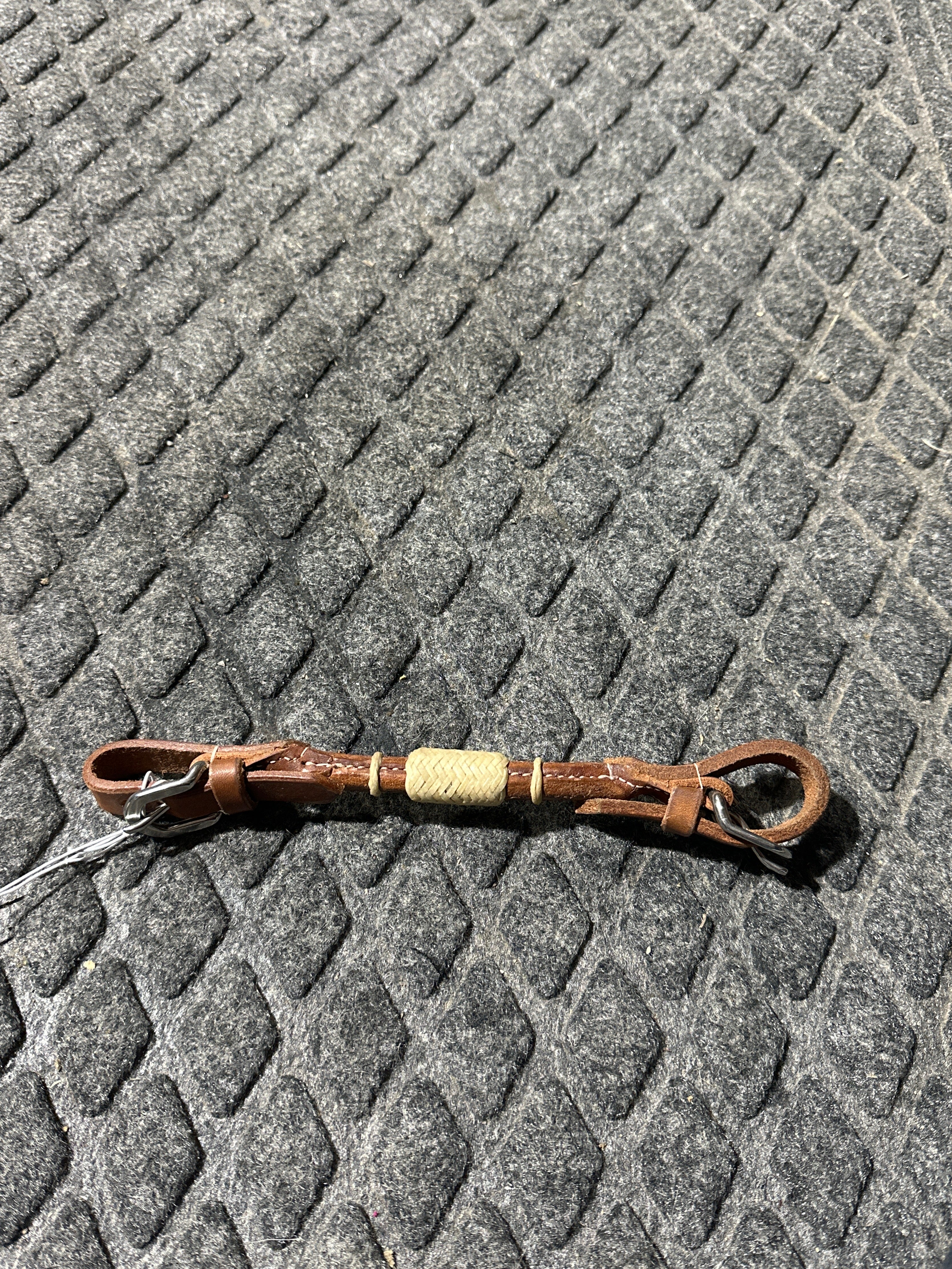 Rolled medium leather with rawhide chin strap