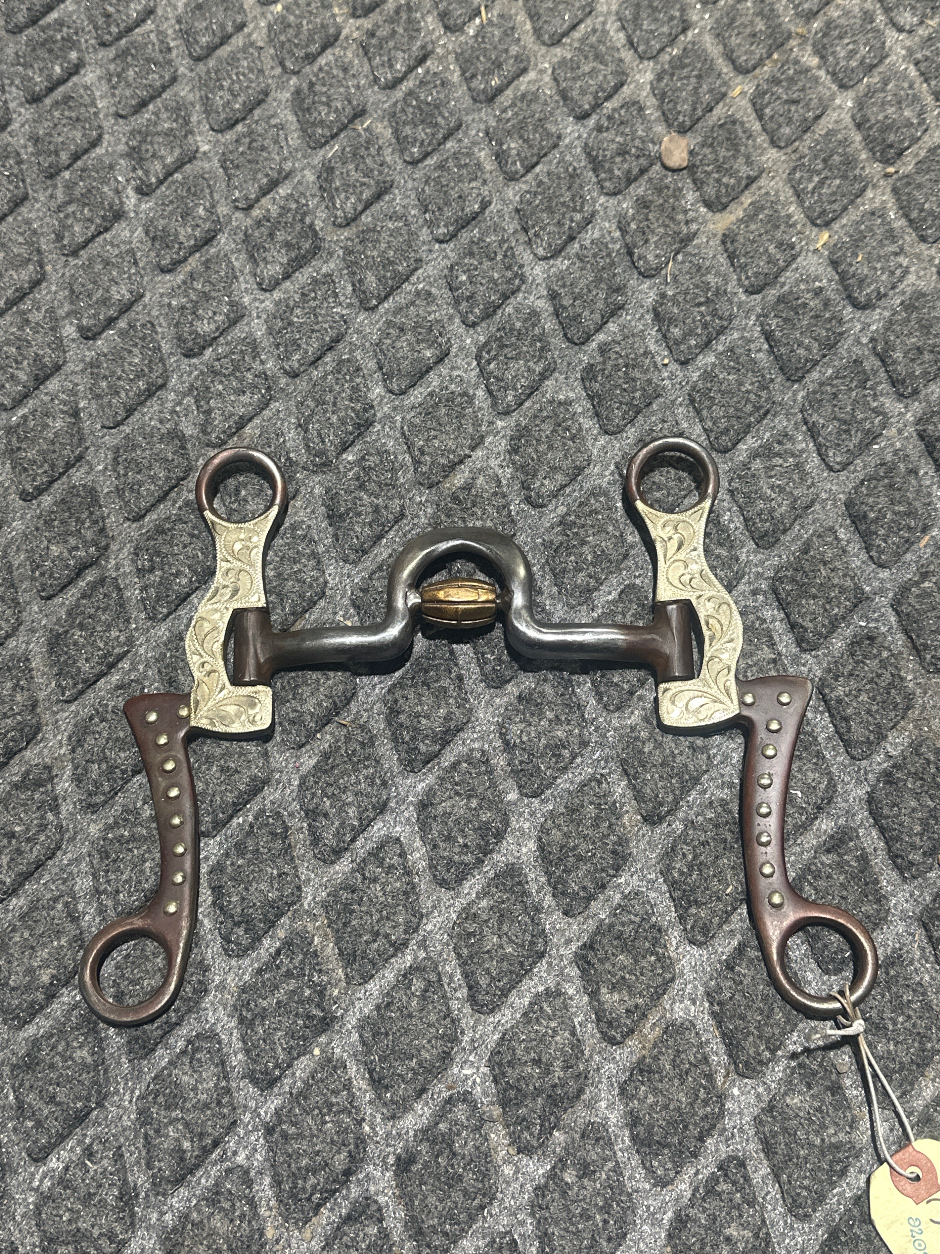 Brown steel spoon bit with roller & silver accent 7 shanks