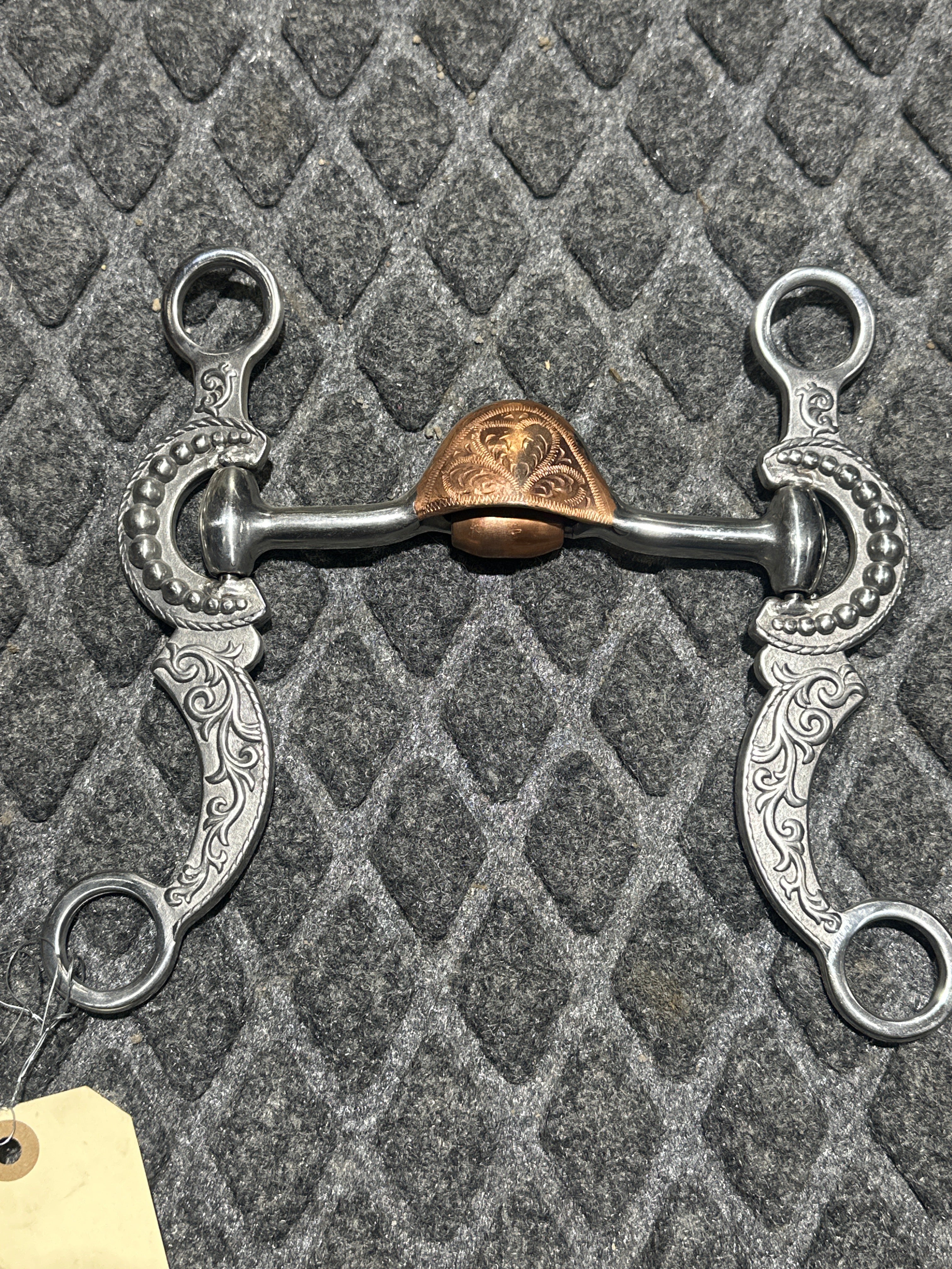 Hooded port with roller and silver accent shanks