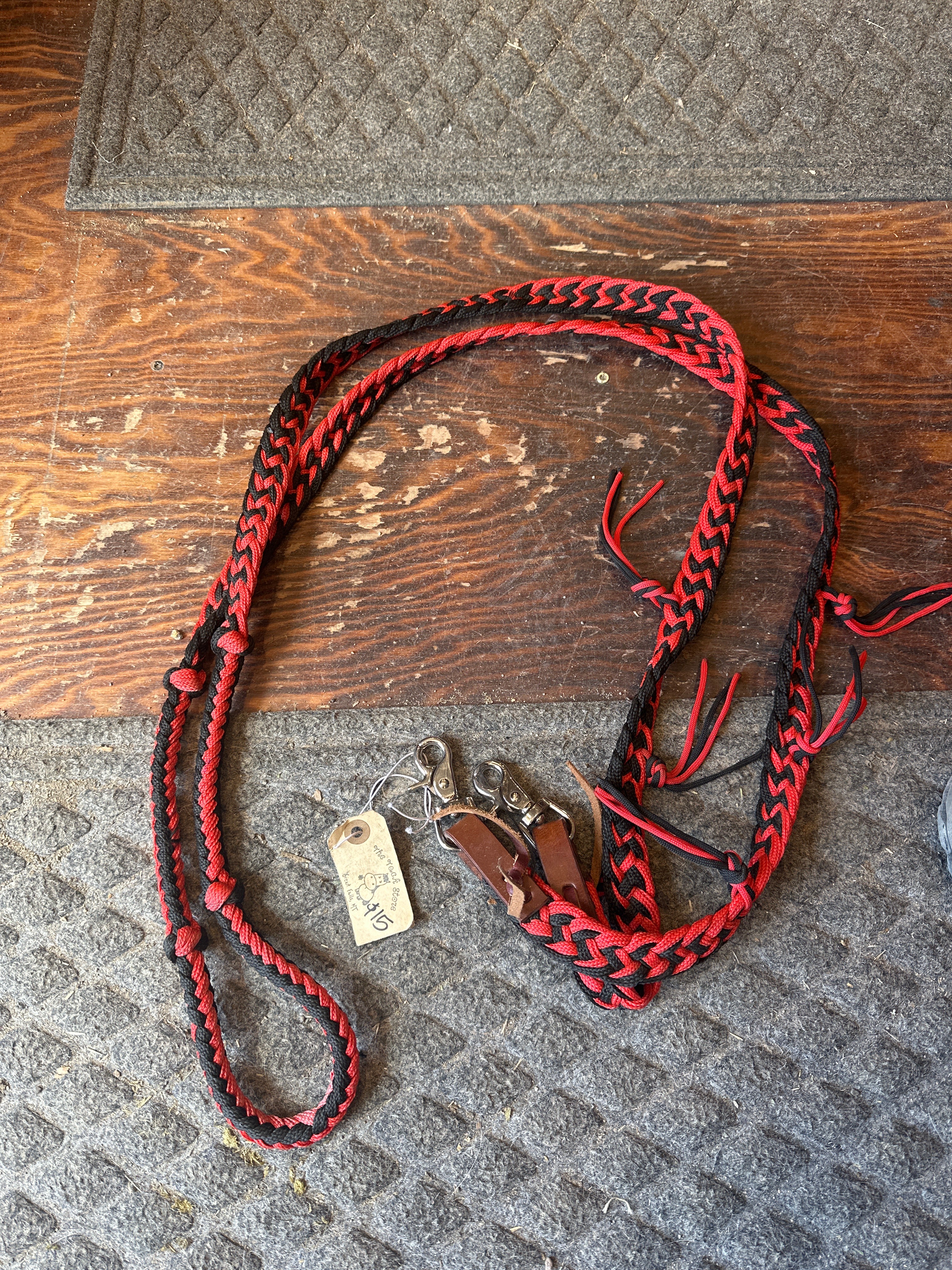 Black and red braided rope rein with fringe ￼