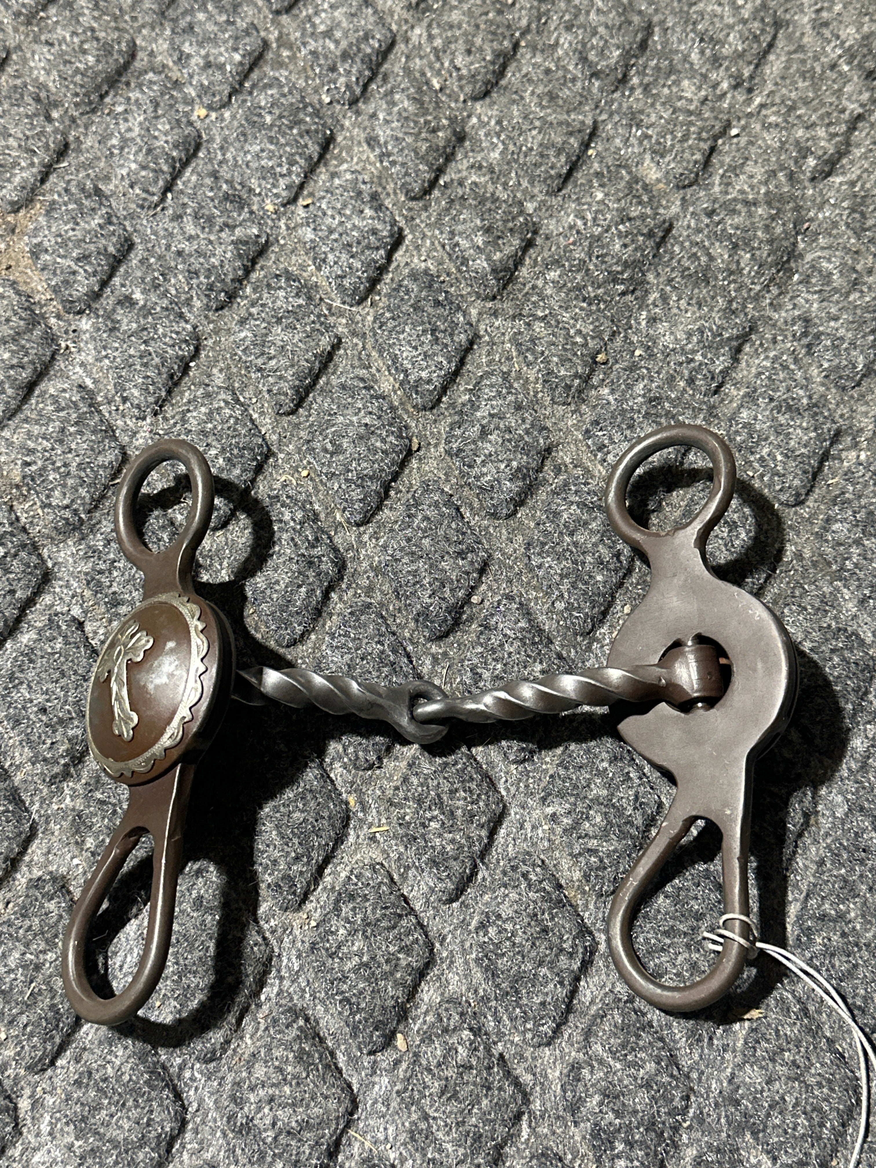 Brown steel concho bit with 2 pc slow twist mouth