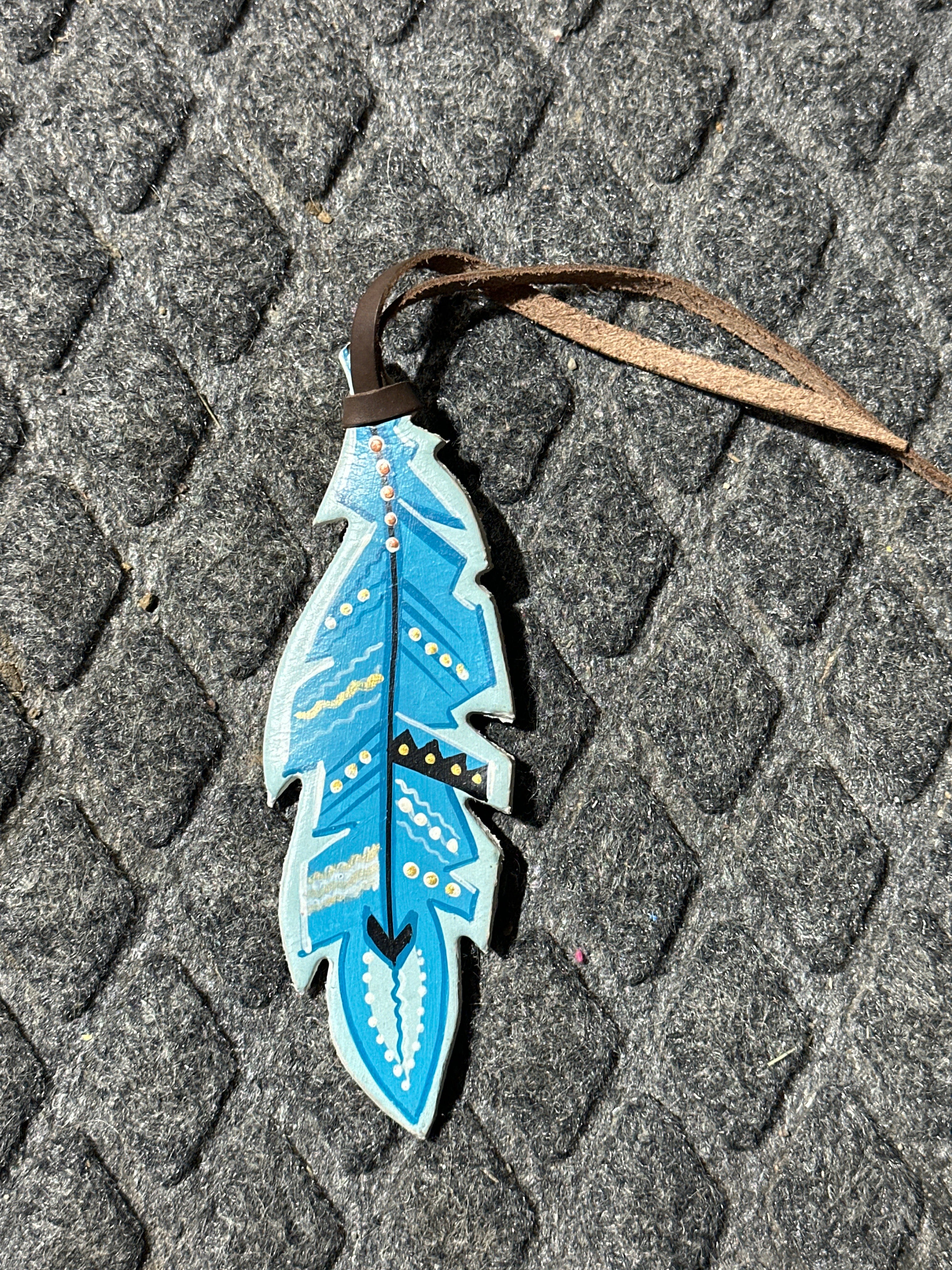 Turquoise painted tie on saddle feather