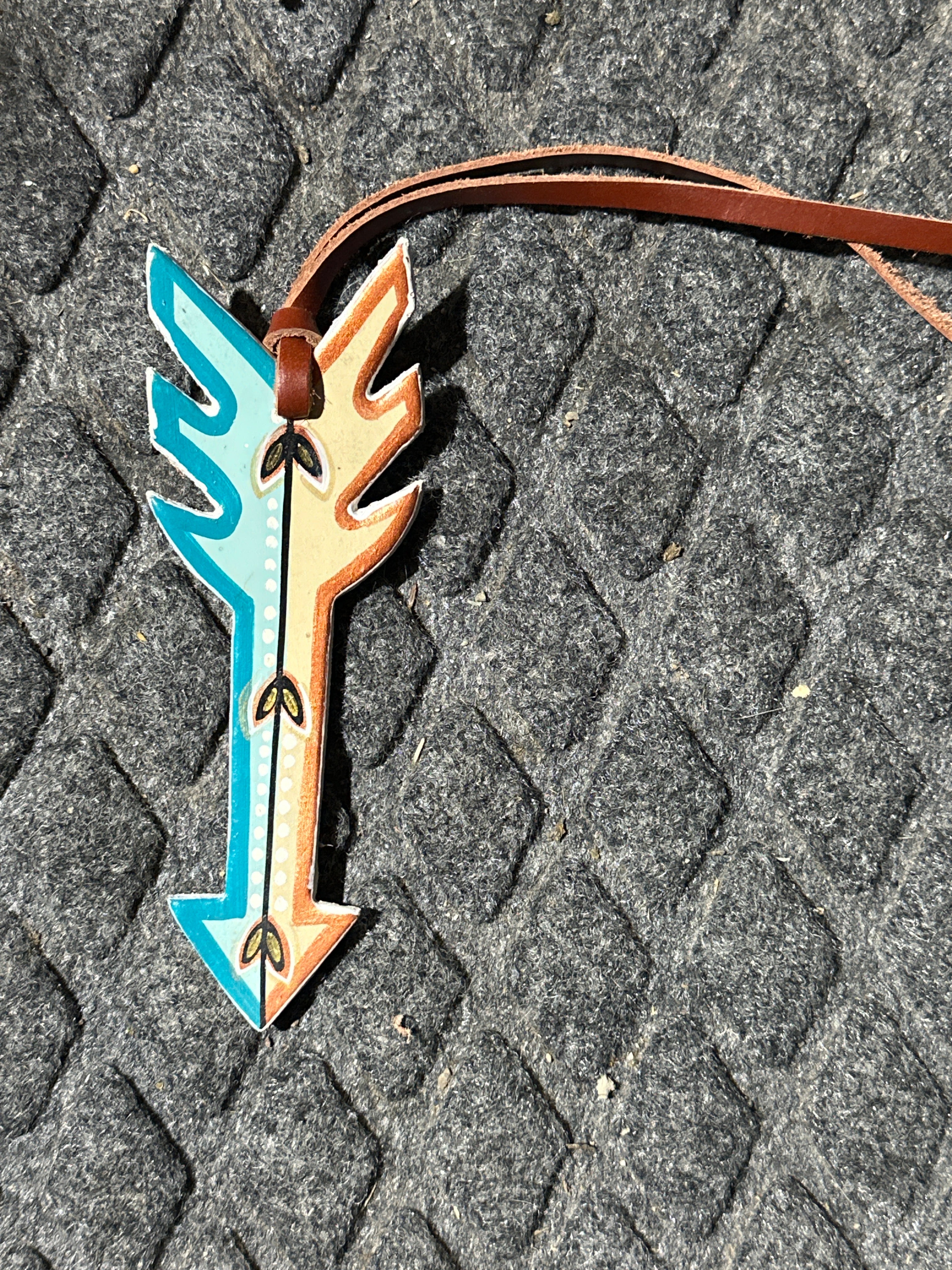 1/2 turquoise & bronze painted arrow tie on saddle charm