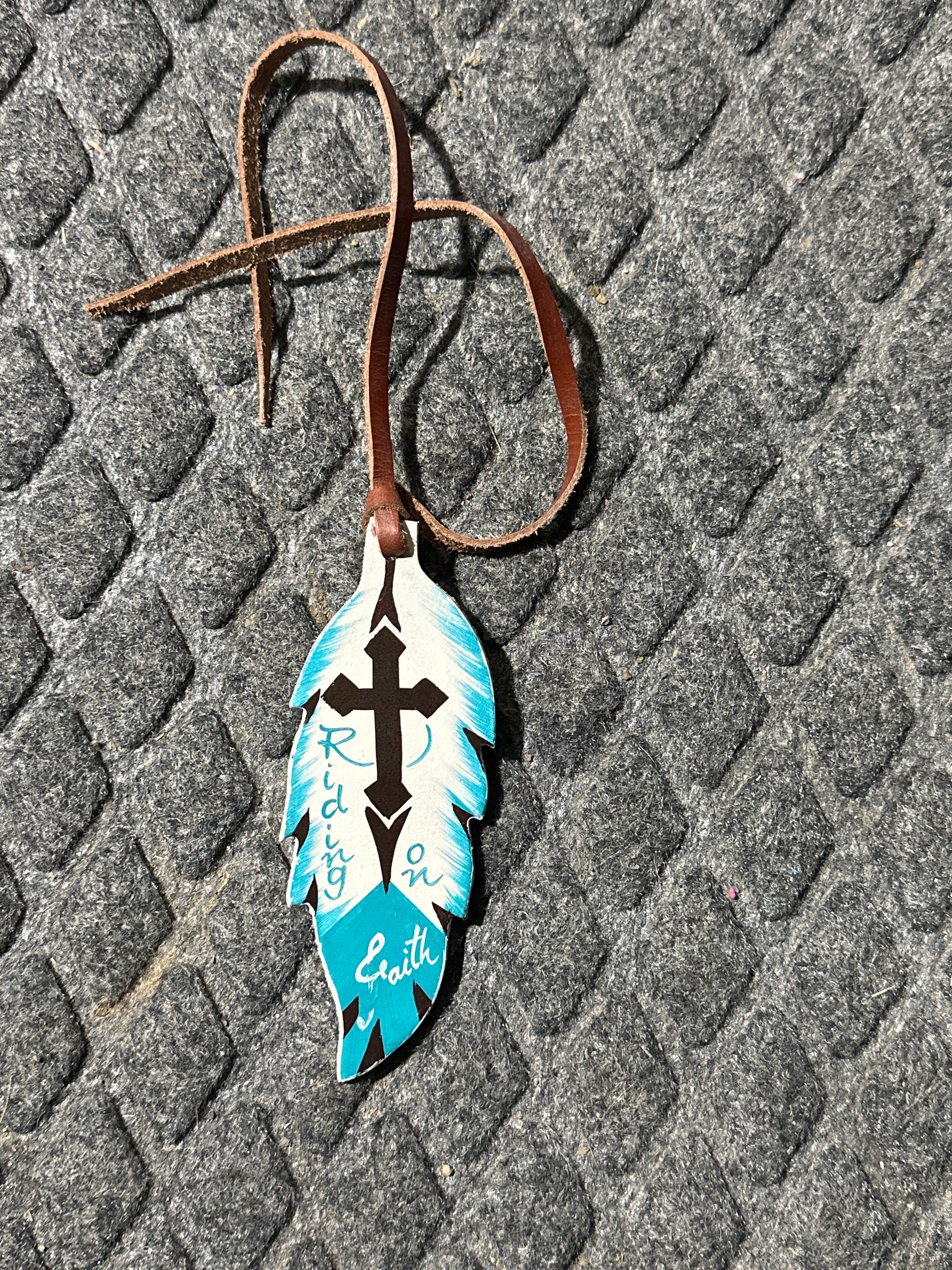 Ride on faith tie on saddle feather