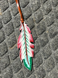 Teal, maroon and white tie on saddle feather
