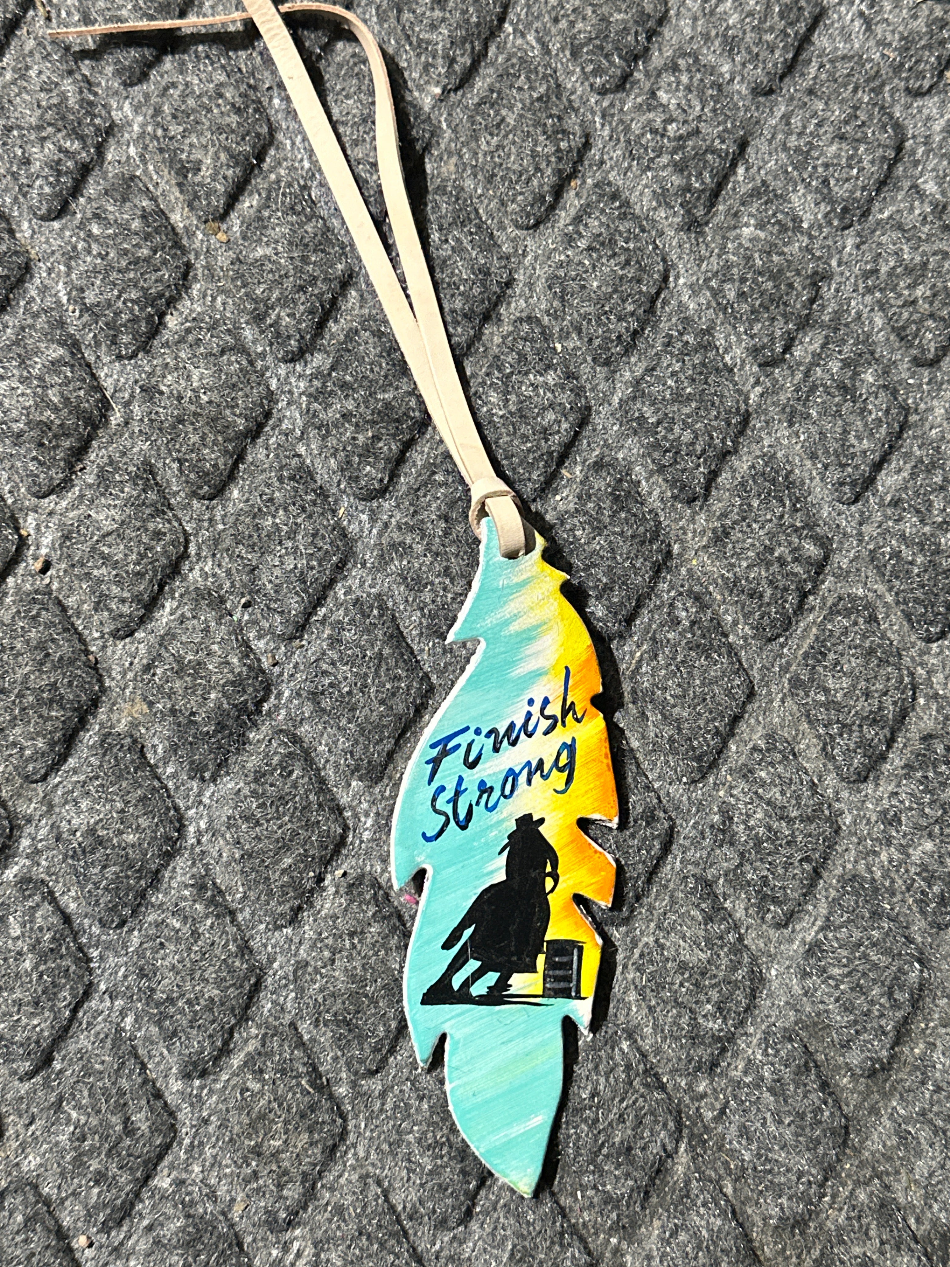 Finish strong barrel racer tie on saddle feather