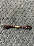 Rolled dark leather with rawhide chin strap