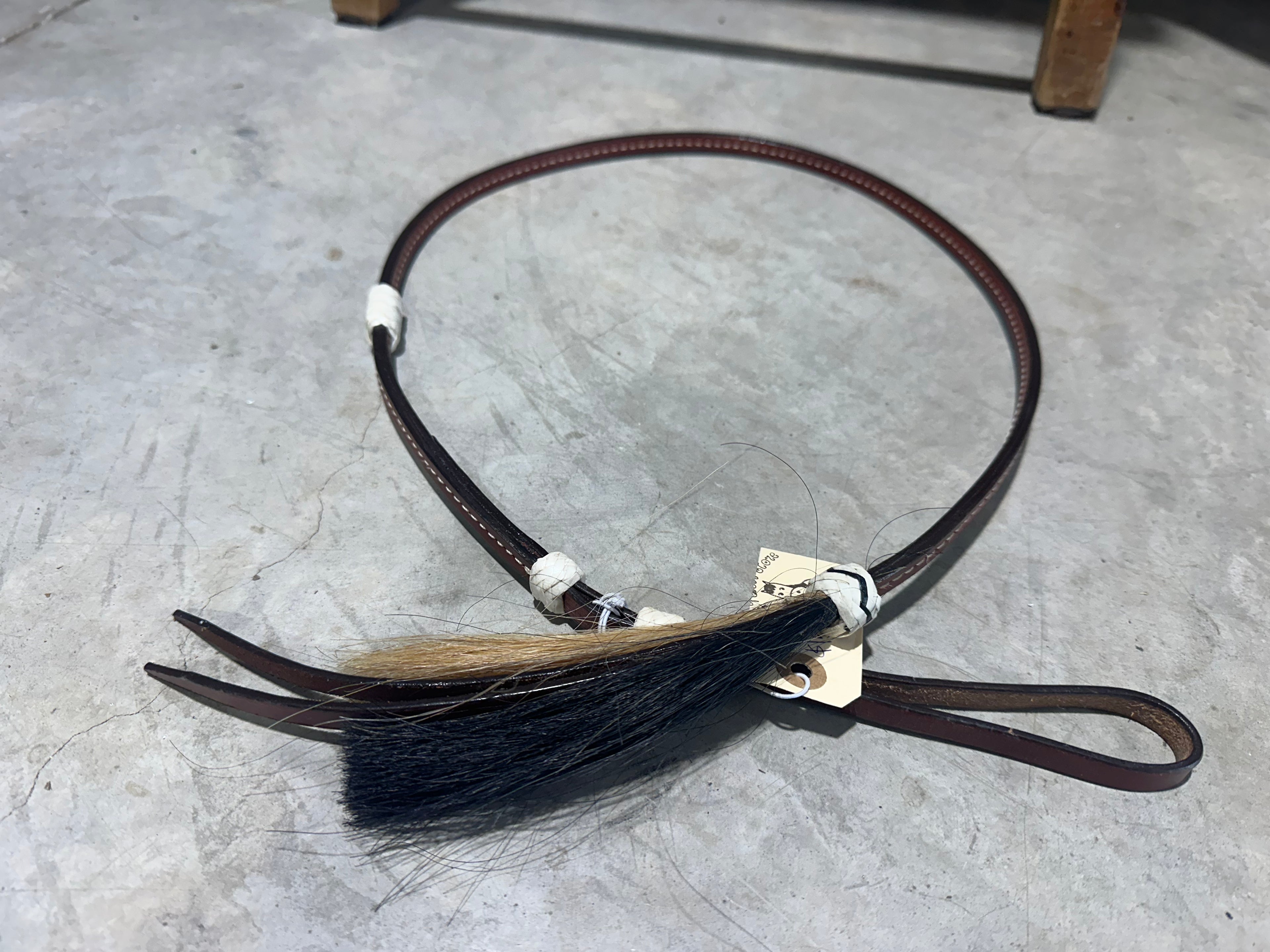 Over & under with rawhide accents & horse hair end